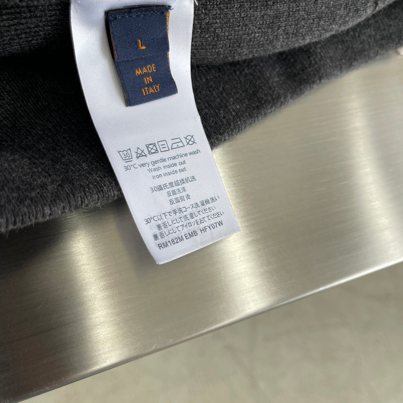 Close-up detail shot of Louis Vuitton luxury clothing with relaxed-fit cut