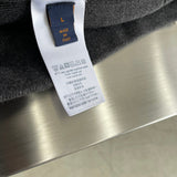 Close-up detail shot of Louis Vuitton luxury clothing with relaxed-fit cut