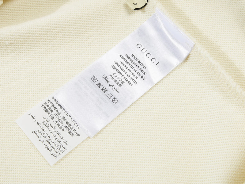 Close-up detail shot of Gucci luxury clothing with streetwear-inspired cut