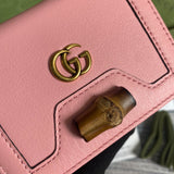 Back view of elevated signature women's handbag – women's statement bag