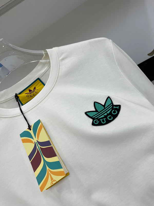 Close-up detail shot of Gucci luxury clothing with logo-detail design