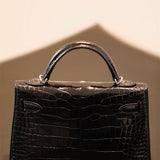 Elegant top-handle bag carried on shoulder 16
