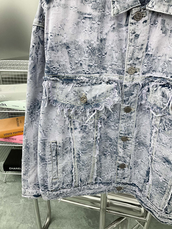 Flat lay presentation of Louis Vuitton luxury clothing with signature branding