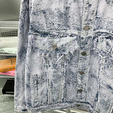 Flat lay presentation of Louis Vuitton luxury clothing with signature branding