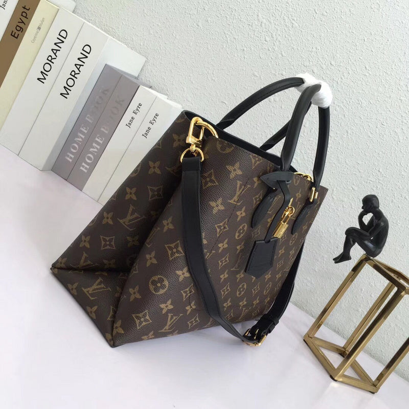 Close-up detail of polished elevated women's handbag – women's luxury accessory