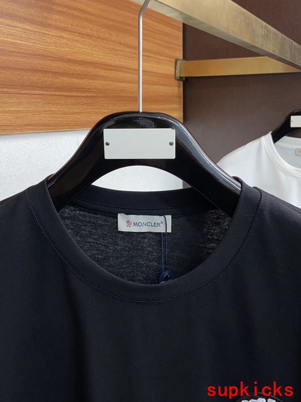Close-up detail shot of Moncler luxury clothing with relaxed-fit cut