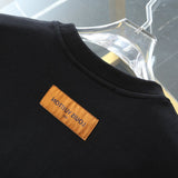 Back view of Louis Vuitton luxury clothing with tailored silhouette
