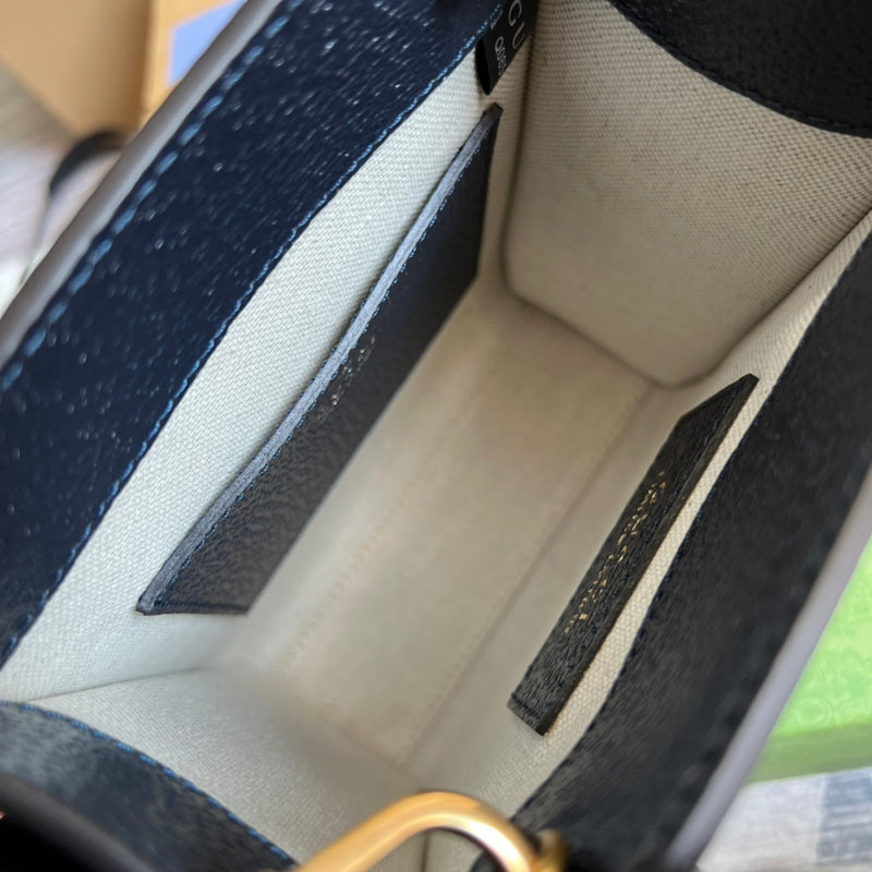 Side profile of sleek signature women's handbag – women's luxury handbag