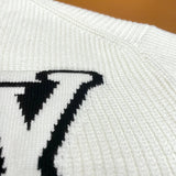Flat lay presentation of Louis Vuitton luxury clothing with monogram-inspired silhouette