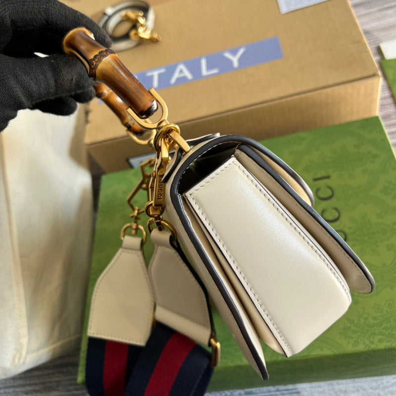 Handle and strap detail of sleek structured women's handbag – women's luxury accessory