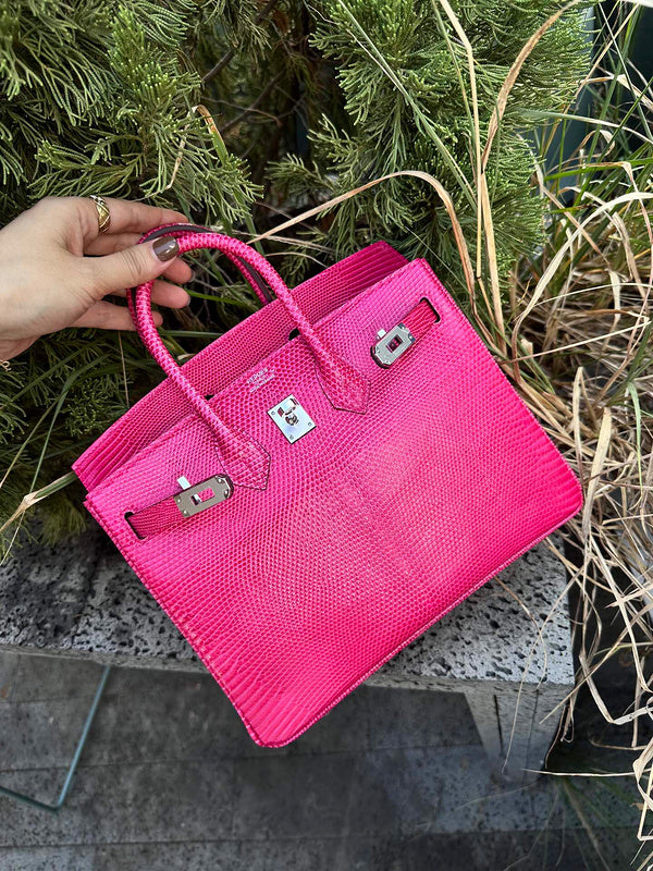 Side view of understated structured handbag
