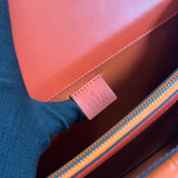 Side profile of classic signature women's handbag – women's luxury accessory