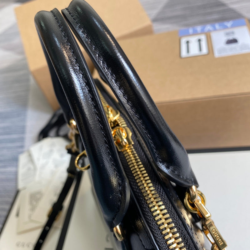 Handle and strap detail of classic refined women's handbag – women's luxury handbag