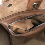 Front view of modern signature women's handbag – women's designer-style accessory