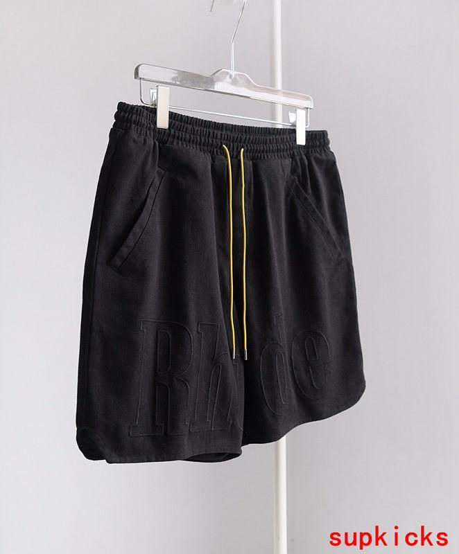 Close-up detail shot of Rhude luxury clothing with everyday silhouette