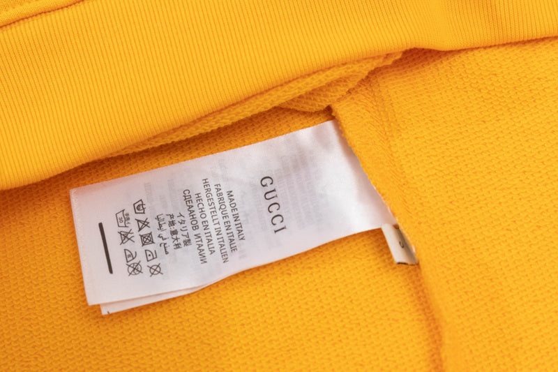 Close-up detail shot of Gucci luxury clothing with tailored silhouette