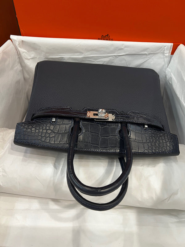 Side view of statement structured handbag