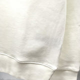 Close-up detail shot of Louis Vuitton luxury clothing with label-forward styling