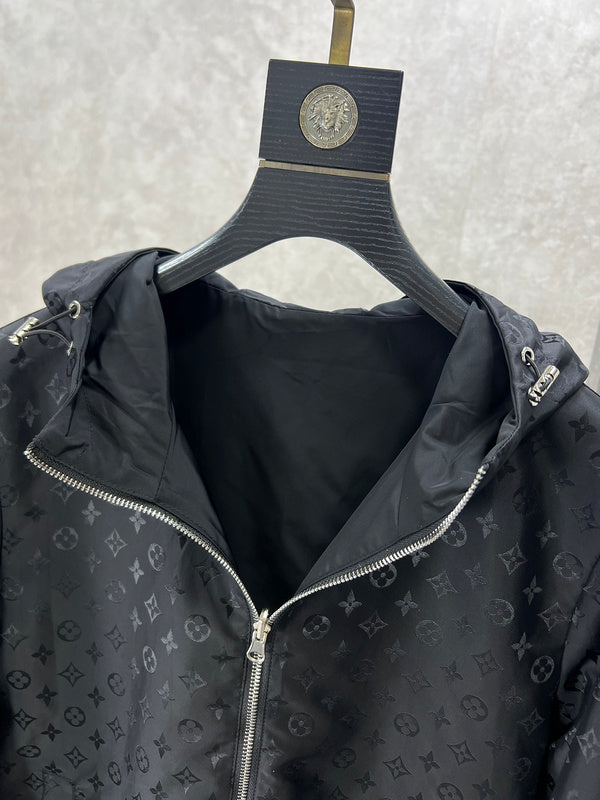 Flat lay presentation of Louis Vuitton luxury clothing with label-forward styling