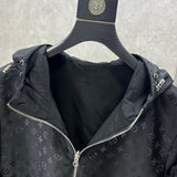 Flat lay presentation of Louis Vuitton luxury clothing with label-forward styling