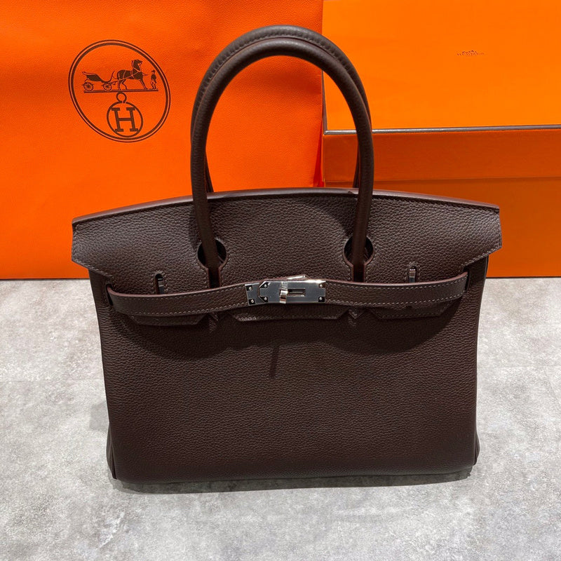 Side view of tailored structured handbag