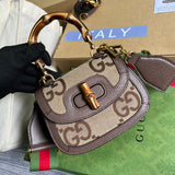 Front view of structured signature women's handbag – women's statement bag