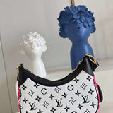 Handle and strap detail of everyday-luxe modern women's handbag – women's designer-style accessory