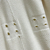 Flat lay presentation of Louis Vuitton luxury clothing with monogram-inspired silhouette