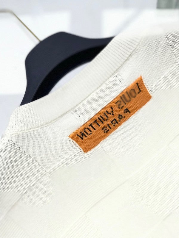 Back view of Louis Vuitton luxury clothing with signature branding
