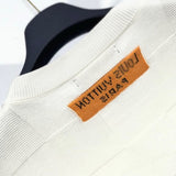 Back view of Louis Vuitton luxury clothing with signature branding