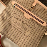 Styled lifestyle shot of elevated signature women's handbag – women's luxury accessory