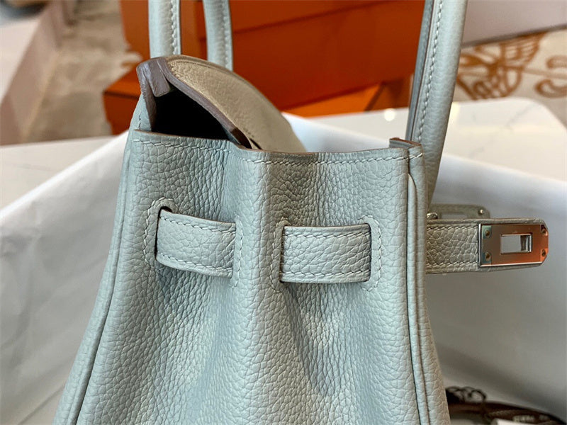 Side view of versatile structured handbag