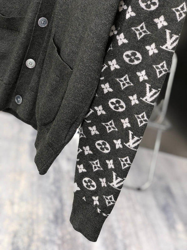 Flat lay presentation of Louis Vuitton luxury clothing with signature branding