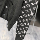 Flat lay presentation of Louis Vuitton luxury clothing with signature branding