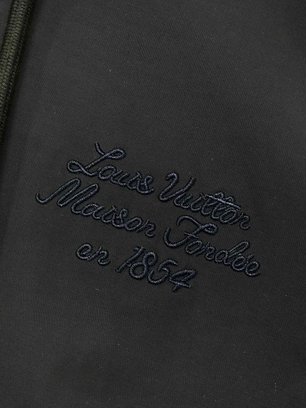 Full styled look of Louis Vuitton luxury clothing with signature branding