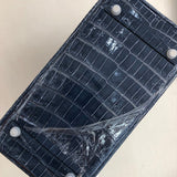 Side view of polished structured handbag