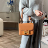 Side view of streamlined structured handbag
