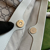 Side profile of premium chic women's handbag – women's luxury accessory