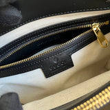 Handle and strap detail of signature polished women's handbag – women's luxury handbag