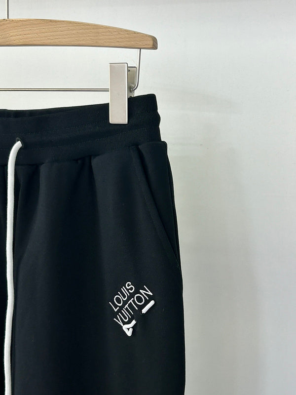 Flat lay presentation of Louis Vuitton luxury clothing with contemporary cut