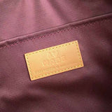 Side profile of sleek premium women's handbag – women's statement bag