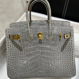 Side view of classic structured handbag