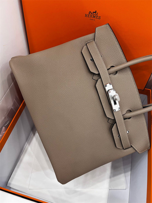  Understated top-handle bag carried on shoulder 10