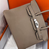  Understated top-handle bag carried on shoulder 10
