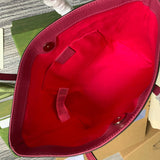 Front view of sleek polished women's handbag – women's statement bag