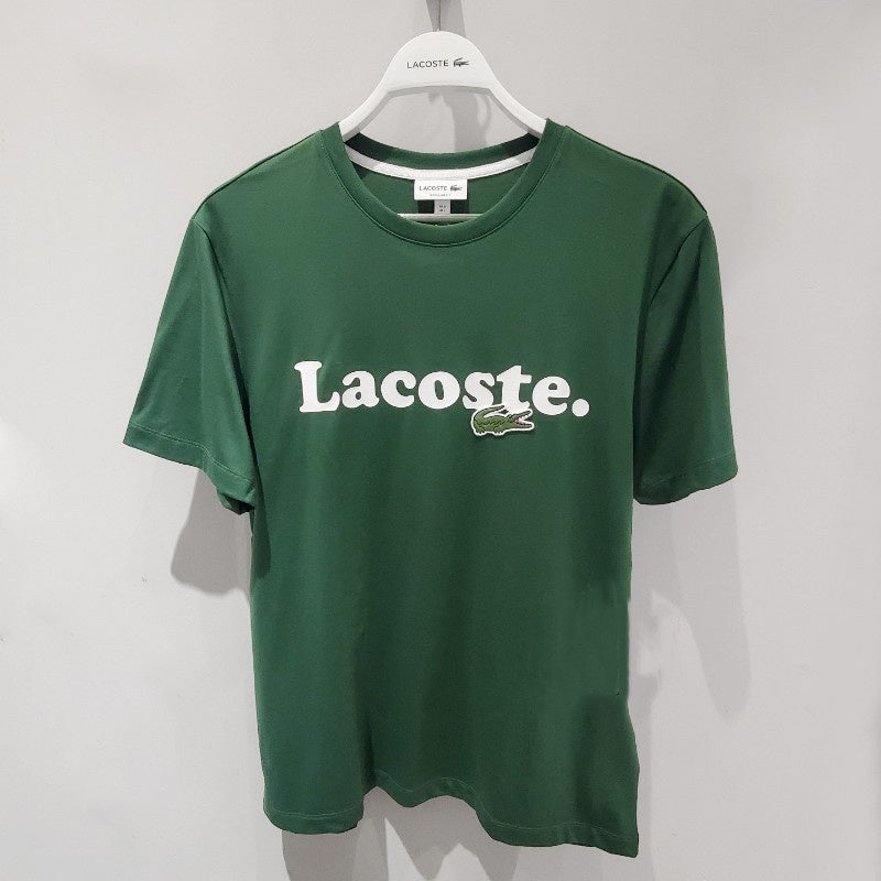 Side profile of Lacoste luxury clothing with signature branding