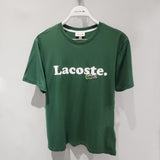 Side profile of Lacoste luxury clothing with signature branding