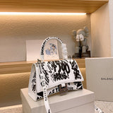 Ziva's Charm handbag – styled view (one versatile size)