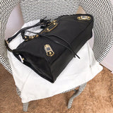 Styled lifestyle shot of refined statement women's handbag – women's luxury handbag