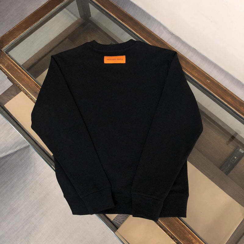 Close-up detail shot of Louis Vuitton luxury clothing with relaxed-fit cut